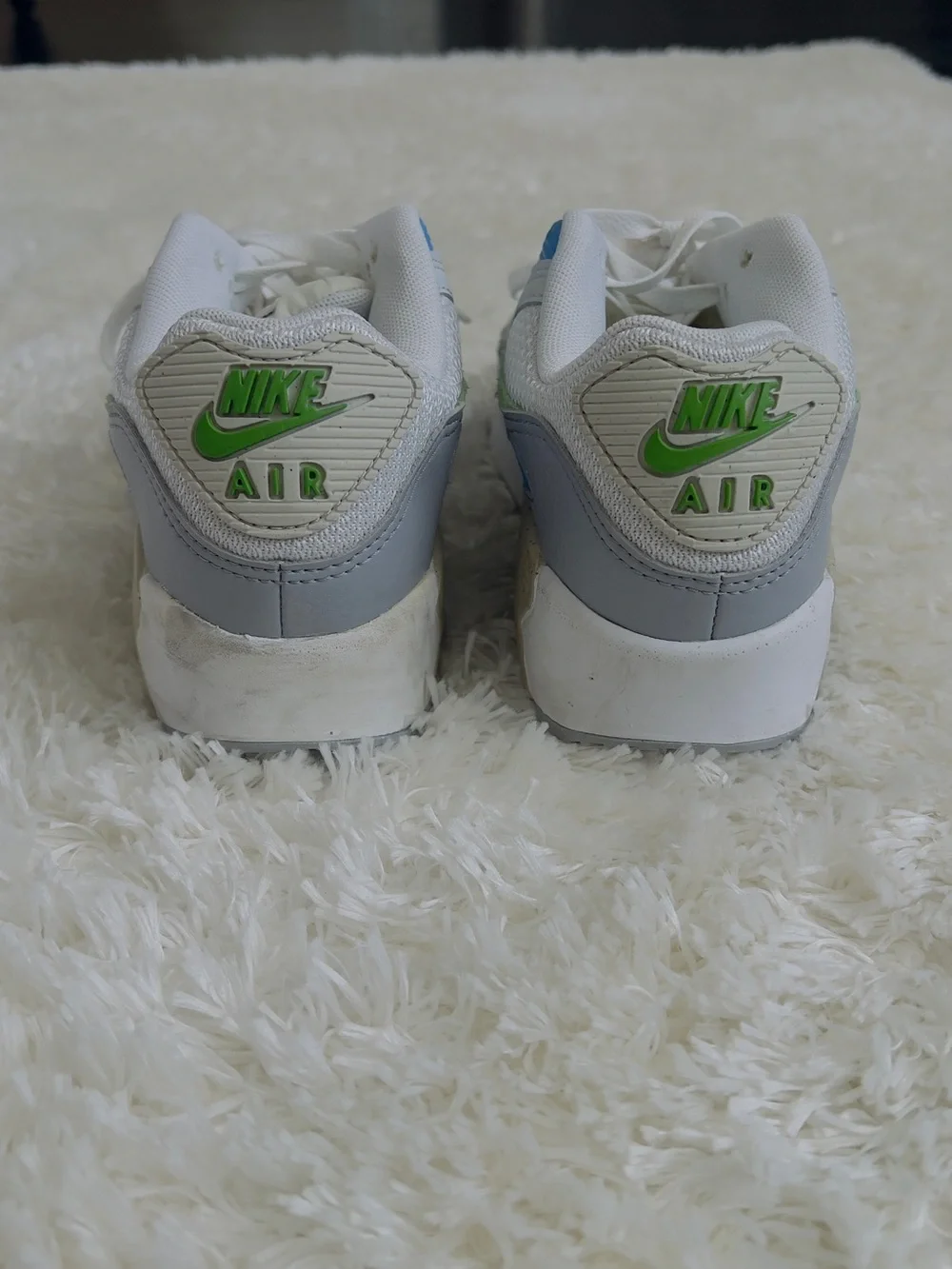 Nike Air Max 90 sneakers in white with blue and green accents